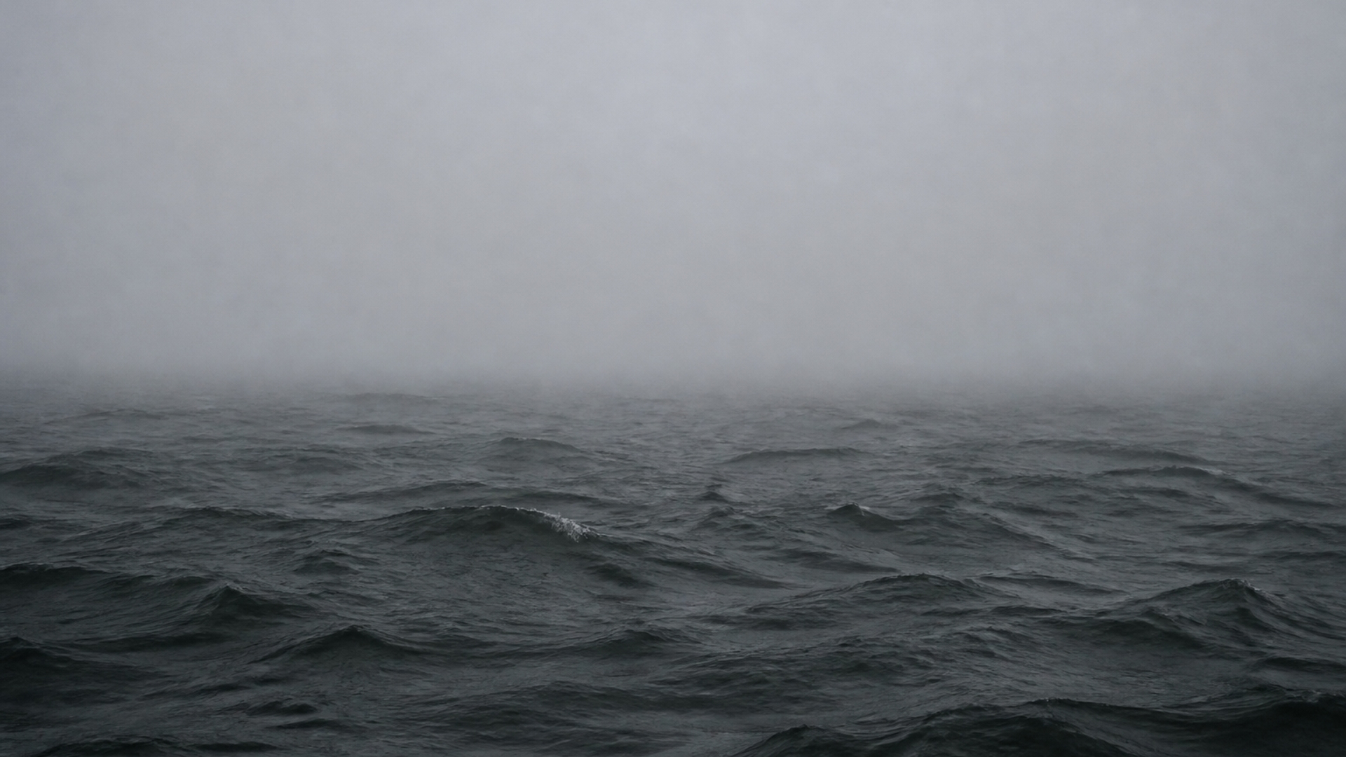 dark grey ocean in fog hd