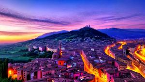 purple sunset above an Italian city