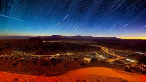 Star trails above the desert timelapse photo