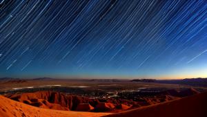 Star trails above the desert timelapse photo