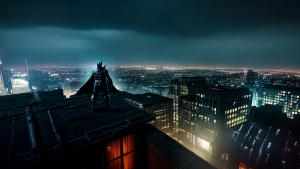 Batman on a rooftop in the rain at night