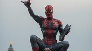 All three live action Spiderman on top of statue of liberty.