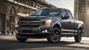 Ford F-150 Supercab, dark gray in color, black rims, and 6'5 in bed 