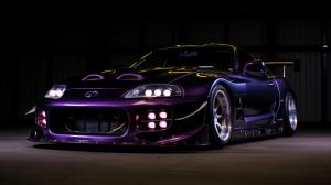 fully carbon fibre supra mkii with exposed engine and purple underlighting
