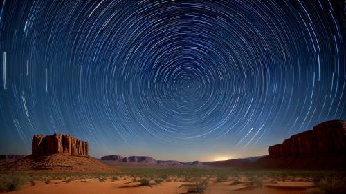 Star trails above the desert timelapse photo