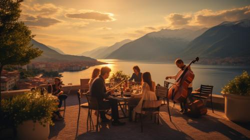 large balcony with family and friends eating food and enjoying traditional music being played by a  stringed quartet. Lake Garda in the background with high mountains at sunset.