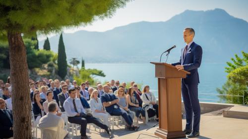 Man standing in a suit with rostrum and stand with microphone on it, many Jehovah's witnesses gathered for exercise patience 2023 convention of Jehovah's Witnesses at a outdoor venue at Lake Garda Northern Italy.