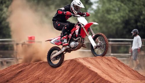 Red dirt bike hitting ramp