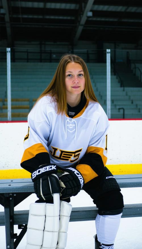  girl on a hockey bench. Posing beautifully